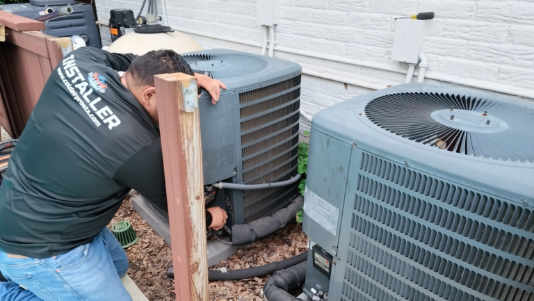 HVAC technician inspecting outdoor air conditioning unit during routine maintenance.